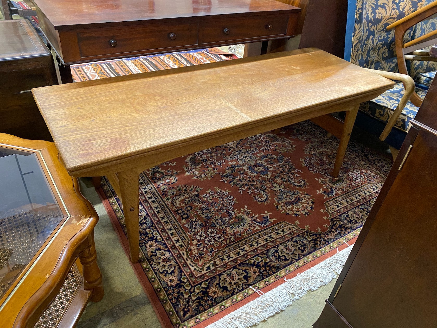 A mid century Trioh type “Copenhagen” metamorphic teak coffee / dining table, width 150cm, depth 54cm, height 72cm and a Nathan teak square occasional table.